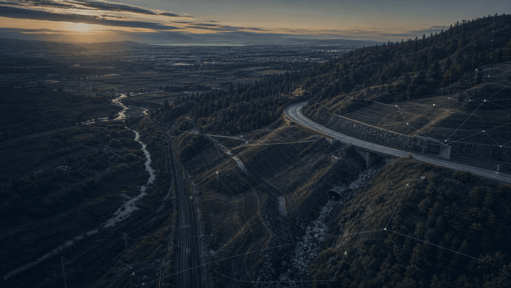 Aerial terrain and infrastructure corridor with geotechnical monitoring overlays